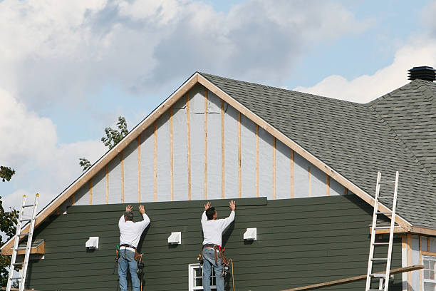 Professional Siding technician working in Tobaccoville, NC